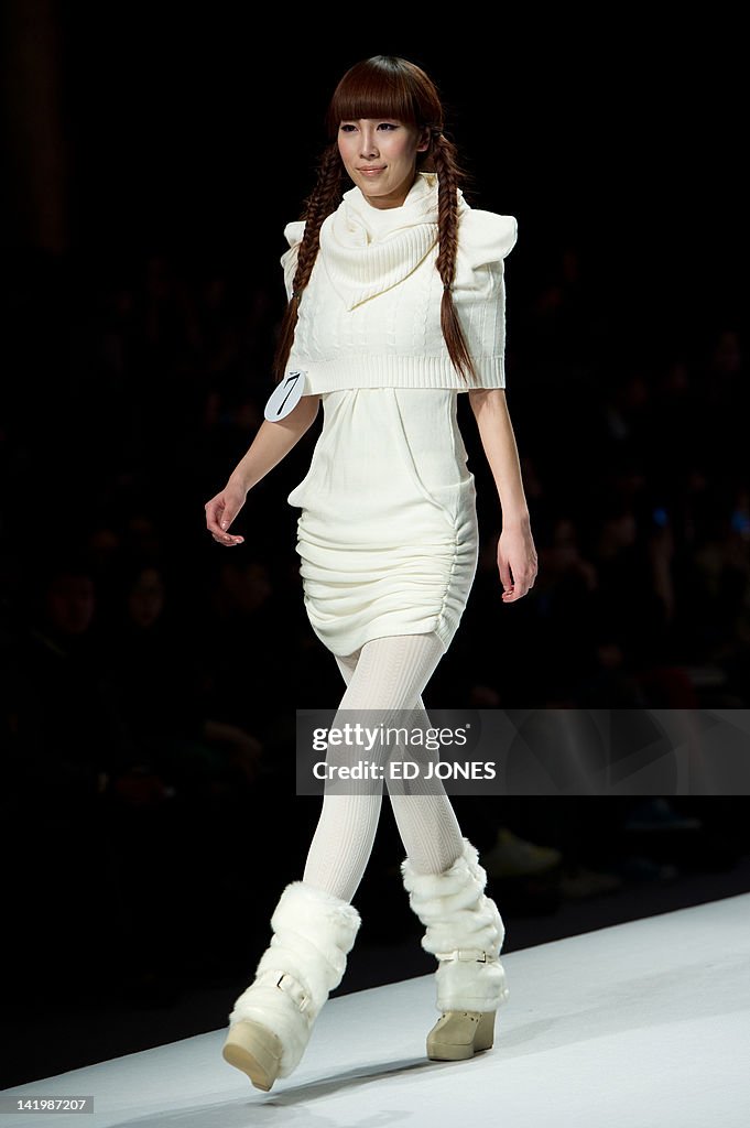 A model presents a creation during the W