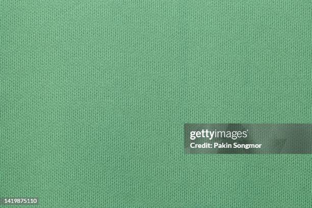green color sports clothing fabric football shirt jersey texture and textile background. - jersey soccer foto e immagini stock