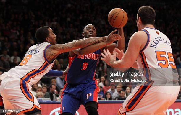 Damien Wilkins of the Detroit Pistons in action against J.R. Smith and Josh Harrellson of the New York Knicks on March 24, 2012 at Madison Square...