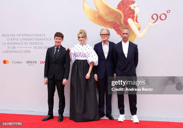 Alex Sharp, Aimee Lou Wood, Bill Nighy and director Oliver Hermanus attend the "Living" red carpet at the 79th Venice International Film Festival on...