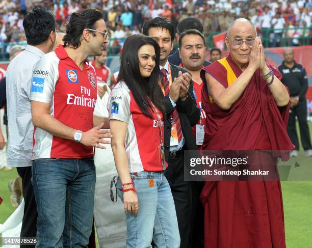 Tibetan Spiritual leader Dalai Lama with Bollywood actress Preity Zinta during the Indian Premier League match at Dharamsala Cricket Stadium.