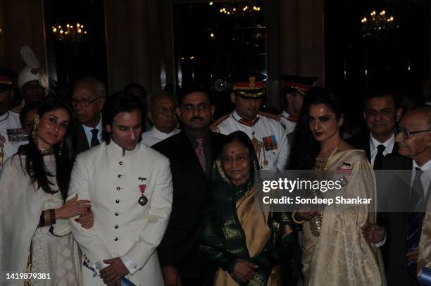 Bollywod acror Saif Ali Khan with wife Kareena, President Pratibha Patil and actor Rekha at the Presidental Palace in New Delhi after the award...