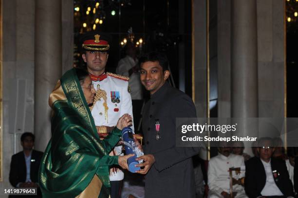 Narain Karthikeyan receiving Padma Shri award from President Pratibha Patil at the Presidential Palace in New Delhi. Karthikeyan is an Indian racing...