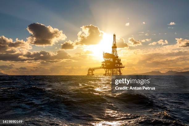 oil platform at sea at sunset. world oil industry - oil platform bildbanksfoton och bilder