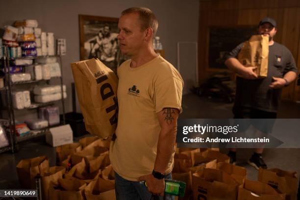 Striking union coal miners pick up groceryies and clothes at a local union hall converted into a pantry for miners and their families on August 31,...