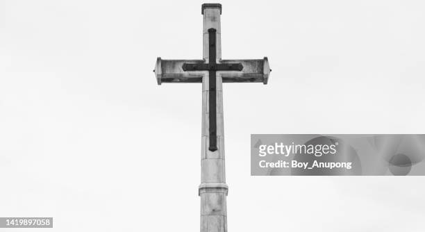 the christian cross of christchurch cathedral in christchurch of new zealand isolated on white sky background. - crucifix stock pictures, royalty-free photos & images