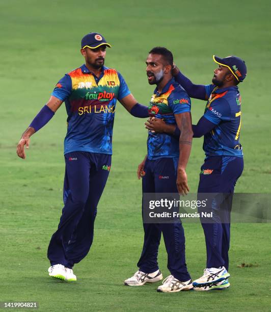 Chamika Karunaratne of Sri Lanka celebrates the wicket of Mushfiqur Rahim of Bangladesh during the DP World T20 match between Sri Lanka and...