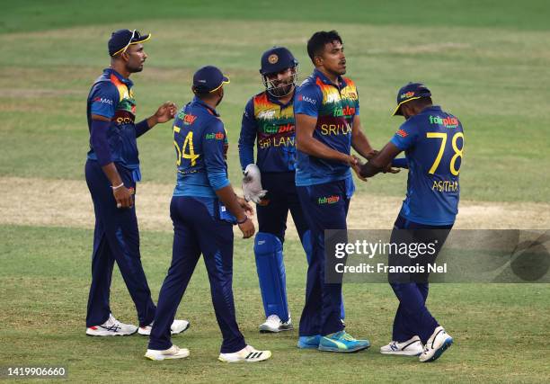 Maheesh Theekshana of Sri Lanka celebrates with team mates after dismissing Shakib Al Hasan of Bangladesh during the DP World T20 match between Sri...