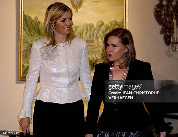 Grand-Duchess Maria-Teresa of Luxembourg stands beside Maxima, Princess of Netherlands, Princess of Orange-Nassau before a diner at Grand-Ducal...