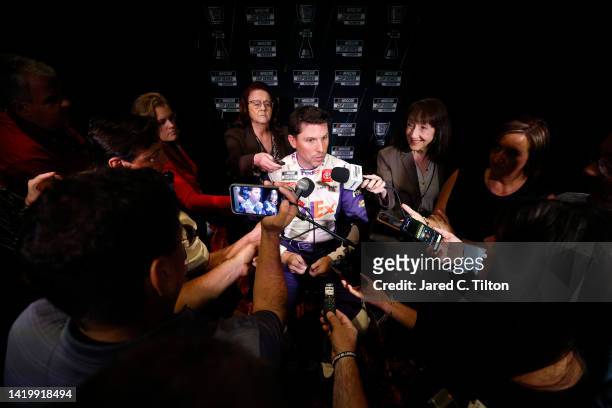 Driver Denny Hamlin speaks with the media during the NASCAR Cup Series Playoff Media Day at Charlotte Convention Center on September 01, 2022 in...