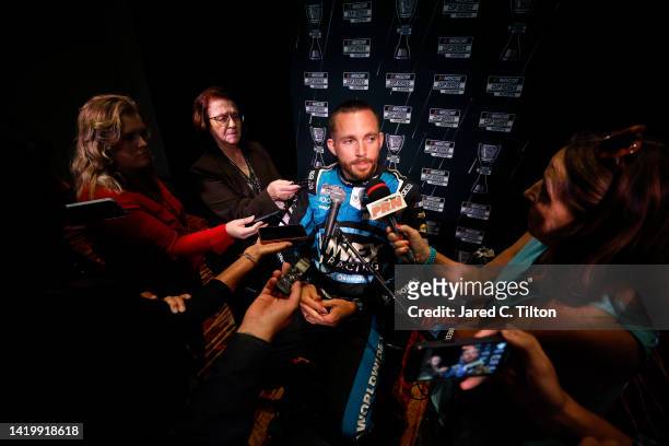 Driver Ross Chastain speaks with the media during the NASCAR Cup Series Playoff Media Day at Charlotte Convention Center on September 01, 2022 in...