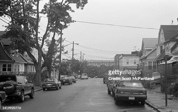View along 37th Avenue of a row of residential homes, in Queens' Corona neighborhood, New York, New York, July 23, 1994. Also visible is Shea Stadium.