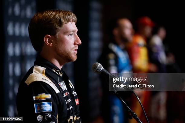 Driver Tyler Reddick speaks with the media during the NASCAR Cup Series Playoff Media Day at Charlotte Convention Center on September 01, 2022 in...