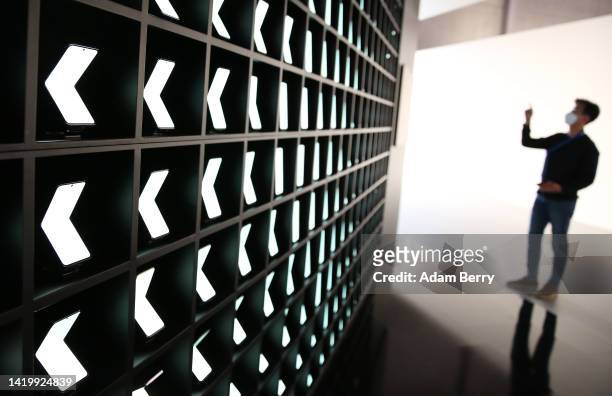 Wall of Samsung Galaxy Z Flip4 mobile phones is seen during a press preview at the IFA 2022 consumer electronics trade fair on September 01, 2022 in...