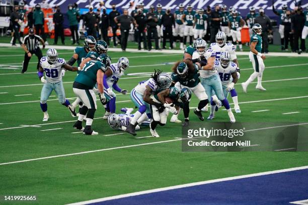 Miles Sanders of the Philadelphia Eagles runs the ball during an NFL game against the Dallas Cowboys on December 27, 2020 in Arlington, Texas.