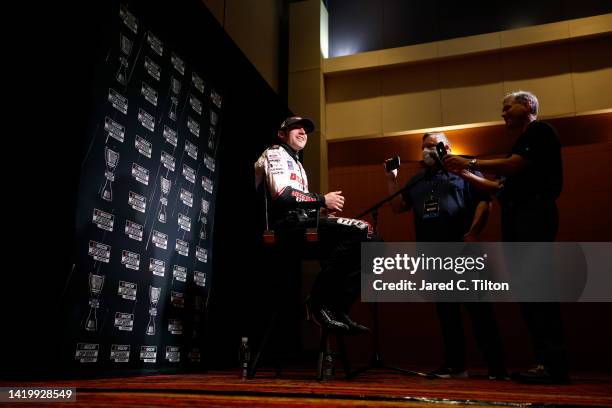 Driver Austin Cindric speaks with the media during the NASCAR Cup Series Playoff Media Day at Charlotte Convention Center on September 01, 2022 in...