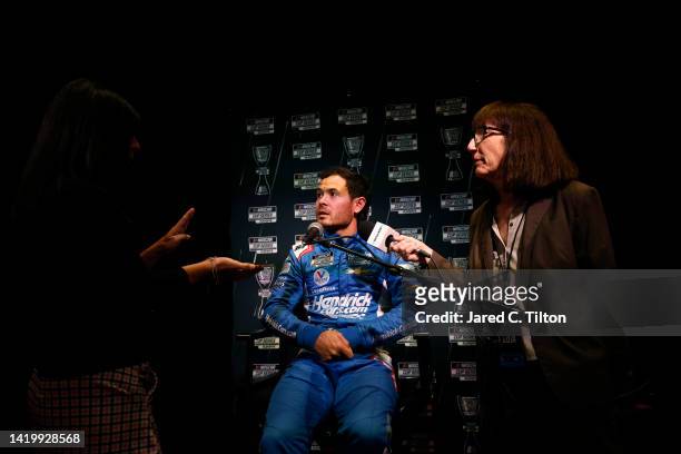 Driver Kyle Larson speaks with the media during the NASCAR Cup Series Playoff Media Day at Charlotte Convention Center on September 01, 2022 in...