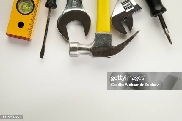 tools for building a house or repairing an apartment, on a white table or background. the foreman's workplace. the theme of home and professional repairs, business and construction industry. copy space. - tools ストックフォトと画像