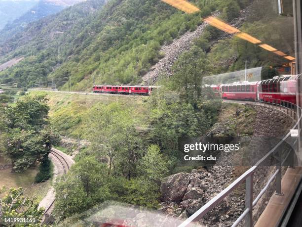 bernina express at the spiral viaduct brusio - brusio grisons stock pictures, royalty-free photos & images