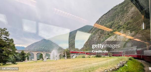 bernina express at the spiral viaduct, brusio - brusio grisons stock pictures, royalty-free photos & images