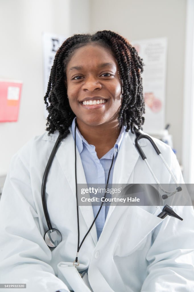 Random Doctor Photo Portrait Of Doctor Smiling In Clinic As She Conducts Telemedicine ...