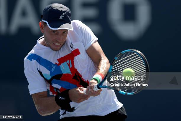 James Duckworth of Australia returns a shot against Daniel Evans of Great Britain during their Men's Singles Second Round match on Day Four of the...