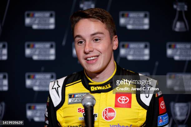 Driver Christopher Bell speaks with the media during the NASCAR Cup Series Playoff Media Day at Charlotte Convention Center on September 01, 2022 in...