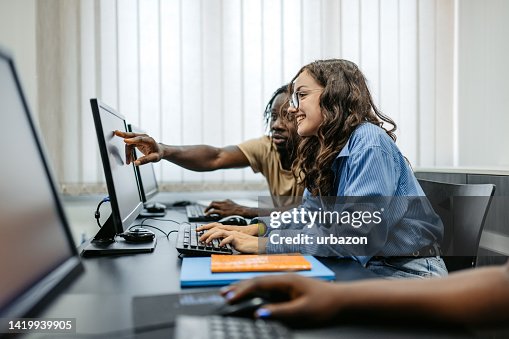 Students Working In Groups In Programing Class Students Working In Groups In Programing Class