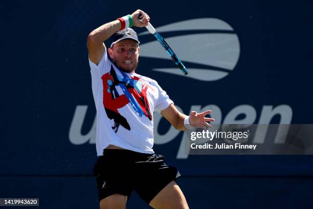 James Duckworth of Australia returns a shot against Daniel Evans of Great Britain during their Men's Singles Second Round match on Day Four of the...