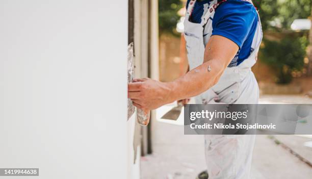 the painter wall - facade painting stock pictures, royalty-free photos & images