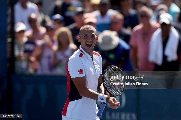 Daniel Evans of Great Britain celebrates after defeating James Duckworth of Australia during their Men's Singles Second Round match on Day Four of...