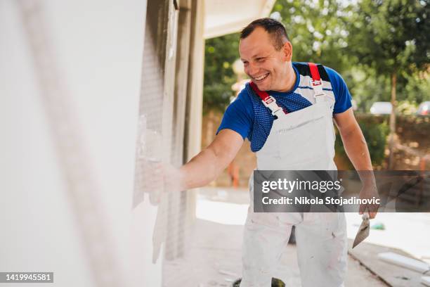 painter man - facade painting stock pictures, royalty-free photos & images