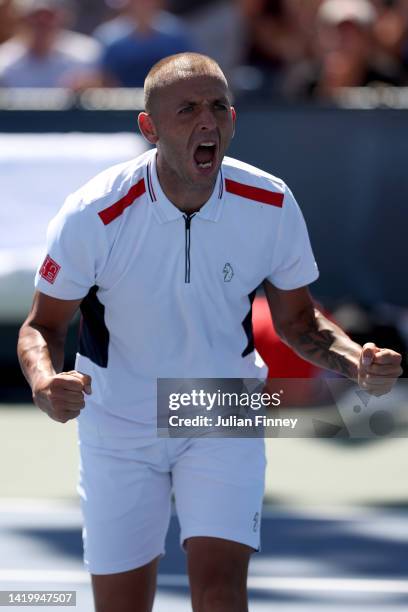 Daniel Evans of Great Britain celebrates after defeating James Duckworth of Australia during their Men's Singles Second Round match on Day Four of...