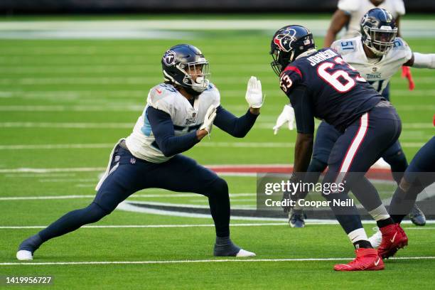 Tennessee Titans defensive end Wyatt Ray battles with Roderick Johnson of the Houston Texans during an NFL game on January 03, 2021 in Houston, Texas.