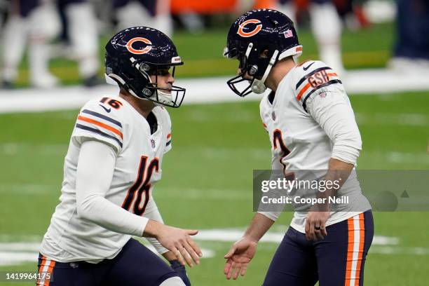 Pat ODonnell of the Chicago Bears celebrates with place kicker Cairo Santos after the kick during an NFL wild-card playoff football game against the...