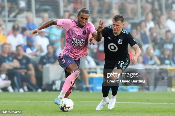 Dominic Calvert-Lewin of Everton dribbles the ball while Robin Lod of Minnesota United defends in the first half of an international friendly at...