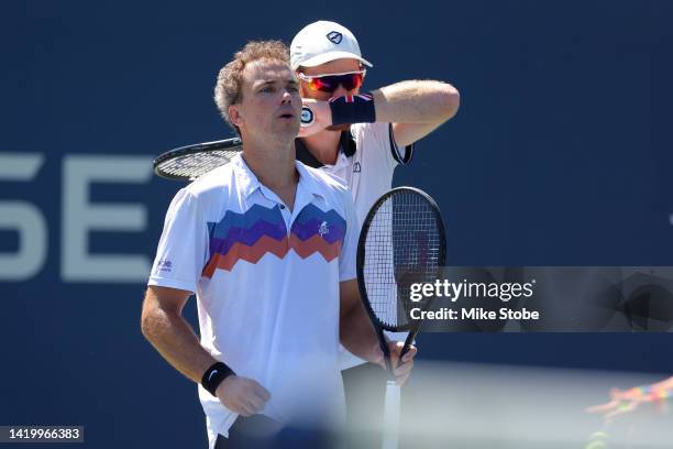 Jamie Murray of Great Britain and Bruno Soares of Brazil look on against Hunter Reese of the United States and Max Schnur of the United States during...