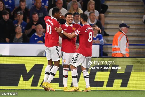 Jadon Sancho of Manchester United celebrates with teammates Marcus Rashford and Bruno Fernandes after scoring their side's first goal during the...
