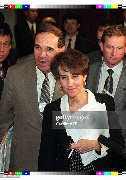 European Commision Vice-President Sir Leon Brittan walks with United States Trade Representative Charlene Barshefky as they leave a meeting room at...