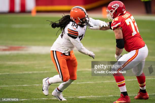 Adrian Clayborn of the Cleveland Browns battles with Eric Fisher of the Kansas City Chiefs during an NFL divisional round playoff football game on...