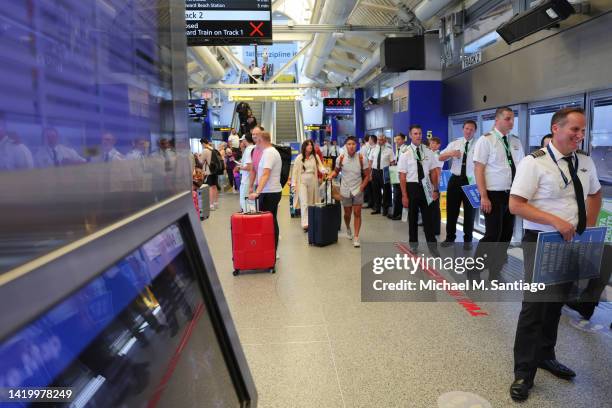 Delta Airlines pilots make their way to Terminal 4 to picket for a new contract at JFK International Airport on September 01, 2022 in New York City....