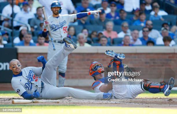 Trayce Thompson of the Los Angeles Dodgers is tagged out at the plate during the second inning by James McCann of the New York Mets at Citi Field on...