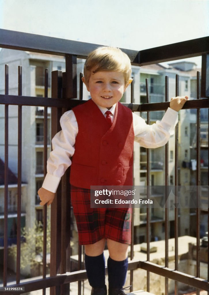 Boy standing on balcony