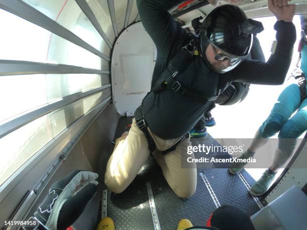 skydivers prepare to jump out of airplane - extreme sports point of view stock pictures, royalty-free photos & images