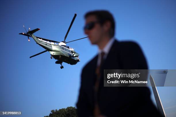 Marine One carries U.S. President Joe Biden from the White House as a Secret Service agent stands guard on September 01, 2022 in Washington, DC....