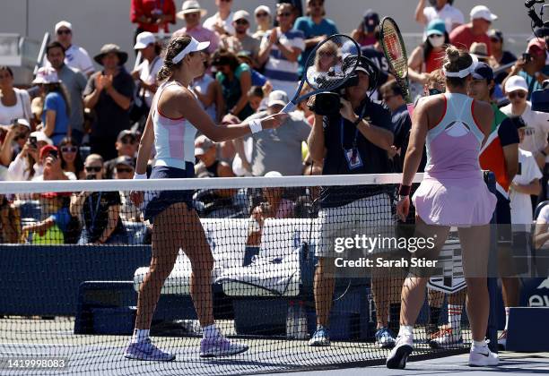 Victoria Azarenka and Marta Kostyuk of Ukraine touch rackets following their Women's Singles Second Round match on Day Four of the 2022 US Open at...