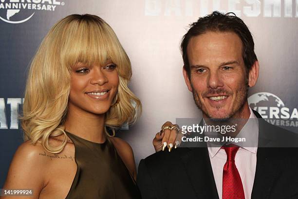 Rihanna and Peter Berg attend a photocall for Battleship at The Corinthia Hotel on March 28, 2012 in London, England.