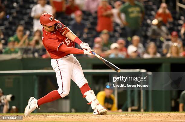 Joey Meneses of the Washington Nationals hits the game winning three-run home run in the tenth inning against the Oakland Athletics at Nationals Park...