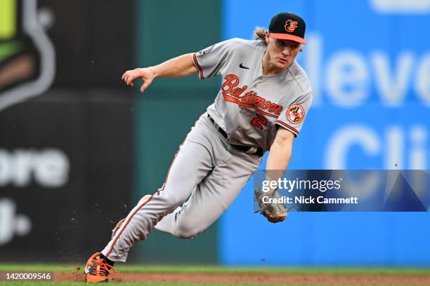 Gunnar Henderson of the Baltimore Orioles fields a ground ball hit by Oscar Gonzalez of the Cleveland Guardians during the fourth inning at...