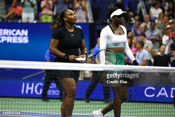Serena Williams and Venus Williams of The United States react after being defeated by Lucie Hradecka and Linda Noskova of Czech Republic during the...
